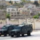 Coches policia israeli en Hebron