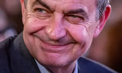 Zapatero sonrie optimista